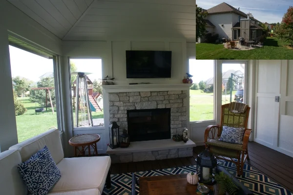 Inside the screen porch, with a fireplace and views into the yard.